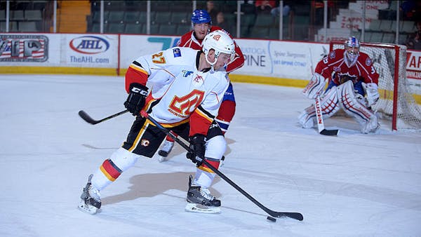 CALGARY FLAMES ACQUIRE 2015 SECOND ROUND DRAFT PICK FROM VANCOUVER FOR SVEN BAERTSCHI