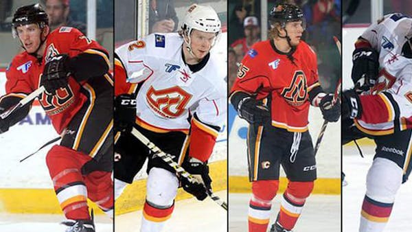 CALGARY ASSIGNS FOUR TO ADIRONDACK
