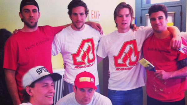 FLAMES PAINT CATHOLIC CHARITIES