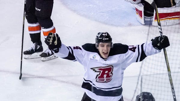 LEADING SCORER RAUTER INKS BACK WITH RUSH