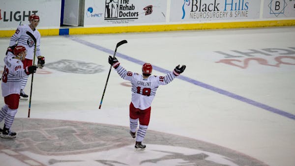 GARLENT’S OT HEROICS GIVE RUSH WIN AND SPIRE SERIES