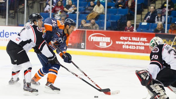 THREE-GOAL FIRST PERIOD HELPS OILERS SLIP PAST RUSH